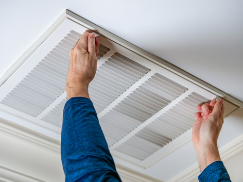 Man,Opening,Ceiling,Air,Vent,To,Replace,Dirty,Hvac,Air